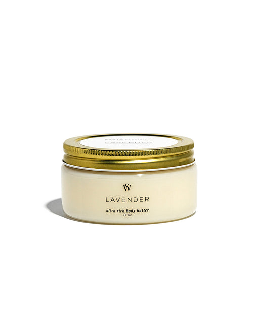 A jar of Lavender Ultra Rich Body Butter with a cream-colored body and a metallic gold lid, set against a plain white background.